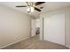 Bedroom with plush carpet flooring, ceiling fan, and a closet at 3209 Cheltenham St, Las Vegas, NV 89129