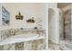 Elegant bathroom features a soaking tub, tiled walls and flooring, and a separate walk-in shower at 3231 Rebel Ave, Pahrump, NV 89048