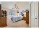 Comfortable bedroom with a ceiling fan, plantation shutters, and neutral carpeting at 3231 Rebel Ave, Pahrump, NV 89048