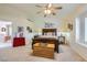Inviting bedroom with warm natural light, ceiling fan, and classic wood furniture at 3231 Rebel Ave, Pahrump, NV 89048