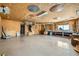 Spacious garage with plywood interior walls and ceiling; a functional workshop area with plenty of room to work at 3231 Rebel Ave, Pahrump, NV 89048