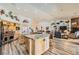 Modern kitchen with custom cabinets, stainless steel appliances, granite countertops, and a center island with bar seating at 3231 Rebel Ave, Pahrump, NV 89048