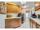 This laundry room boasts ample cabinetry, a sink, and modern washer and dryer units at 3231 Rebel Ave, Pahrump, NV 89048