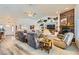 Inviting living room featuring a stone fireplace, built-in shelving, comfortable seating, and ample natural light at 3231 Rebel Ave, Pahrump, NV 89048
