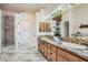Beautifully designed main bathroom with double sinks, granite countertops, and a luxurious walk-in shower at 3231 Rebel Ave, Pahrump, NV 89048