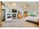 Main bedroom boasts a fireplace, TV, vaulted ceiling, and an attached bathroom with a walk-in shower at 3231 Rebel Ave, Pahrump, NV 89048