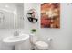 Clean bathroom featuring a round sink, toilet, and modern decor at 328 Owens Peak Dr, Henderson, NV 89015