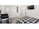 Modern bedroom featuring dark bed frame, desk, and closet with sliding doors at 328 Owens Peak Dr, Henderson, NV 89015