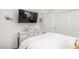 Bedroom with a TV mounted on the wall, a sliding door closet, and white wooden dresser at 328 Owens Peak Dr, Henderson, NV 89015