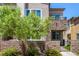 Stunning townhome with stone accents, a cozy balcony, and a well-maintained front garden at 328 Owens Peak Dr, Henderson, NV 89015