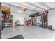 Spacious garage with storage, epoxy floor, and overhead racks at 328 Owens Peak Dr, Henderson, NV 89015