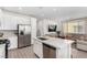 Contemporary kitchen boasts stainless steel appliances, quartz countertops, and ample cabinet space at 328 Owens Peak Dr, Henderson, NV 89015