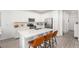 Stylish kitchen island with bar seating, modern appliances, and ample countertop space for cooking at 328 Owens Peak Dr, Henderson, NV 89015