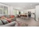 Open-concept living area with a spacious kitchen island, dining table, and cozy seating area at 328 Owens Peak Dr, Henderson, NV 89015