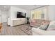 Modern living room showcasing a sleek entertainment center, large TV, and neutral color palette at 328 Owens Peak Dr, Henderson, NV 89015