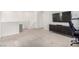Spacious room with modern media center, game console, chair and mounted TV at 328 Owens Peak Dr, Henderson, NV 89015