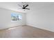Bright bedroom with neutral walls, wood-look flooring, and window with backyard views at 3793 Casa Colorado Ave, Las Vegas, NV 89121