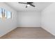 Bedroom featuring wood-look floors, neutral walls, and window with neighborhood views at 3793 Casa Colorado Ave, Las Vegas, NV 89121