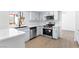 Modern kitchen with stainless steel appliances and quartz countertops with stainless steel hardware at 3793 Casa Colorado Ave, Las Vegas, NV 89121