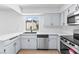 Updated kitchen featuring stainless steel appliances, white cabinets and countertop space at 3793 Casa Colorado Ave, Las Vegas, NV 89121