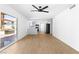 Bright living room boasts an open floor plan with wood floors and views of the private outdoor patio at 3793 Casa Colorado Ave, Las Vegas, NV 89121