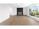 The living room is bright and spacious with a decorative brick fireplace and large bright windows at 3793 Casa Colorado Ave, Las Vegas, NV 89121