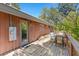 Balcony featuring a wood deck, natural wood railings and partial views of trees and sky at 3971 Arlberg Way, Mount Charleston, NV 89124