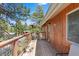 Cozy balcony features wood railings with views of green trees and clear sky at 3971 Arlberg Way, Mount Charleston, NV 89124