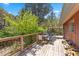 Balcony with wood railings, deck and seating with views of lush greenery at 3971 Arlberg Way, Mount Charleston, NV 89124