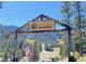 Rustic wooden entrance to Lee Canyon resort with American flag at 3971 Arlberg Way, Mount Charleston, NV 89124