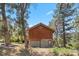 Charming two-story cabin surrounded by lush trees, featuring a rustic design with a cozy, natural setting at 3971 Arlberg Way, Mount Charleston, NV 89124