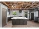 Modern kitchen featuring an island with granite countertops, dark cabinets, and modern appliances at 3971 Arlberg Way, Mount Charleston, NV 89124