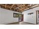 Living area with deck access, exposed beam ceiling, and neutral walls, creating a blank canvas at 3971 Arlberg Way, Mount Charleston, NV 89124