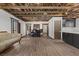 The living space includes a bar area, exposed beam ceiling, and view to the kitchen, perfect for entertaining at 3971 Arlberg Way, Mount Charleston, NV 89124