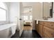 Bathroom features freestanding tub, black marble flooring and modern faucet at 4065 Genoa Dr, Las Vegas, NV 89141