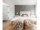 Comfortable bedroom features a bed with decorative pillows and stylish decor at 4065 Genoa Dr, Las Vegas, NV 89141