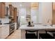Charming kitchen featuring stainless steel appliances, marble counters, and wood-tone cabinetry at 4065 Genoa Dr, Las Vegas, NV 89141