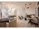 Bright, open living room featuring a modern fireplace and seamless flow into dining area at 4065 Genoa Dr, Las Vegas, NV 89141