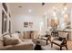 Bright and spacious living area featuring contemporary furnishings, stylish lighting, and an open layout at 4065 Genoa Dr, Las Vegas, NV 89141