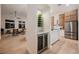 Open-concept living and kitchen area with modern finishes and a stylish wine storage at 4065 Genoa Dr, Las Vegas, NV 89141