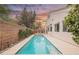 Inviting backyard pool perfect for swimming laps, set against the backdrop of a colorful sky at 4065 Genoa Dr, Las Vegas, NV 89141
