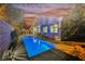 An inviting backyard featuring a private pool, lush landscaping, and a serene setting perfect for relaxation and entertainment at 4065 Genoa Dr, Las Vegas, NV 89141