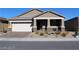 Charming single-story home with a low-maintenance desert-style landscaped front yard and attached two-car garage at 4108 Fairywren Dr, North Las Vegas, NV 89031