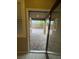 Covered patio with brick flooring, seen through a sliding glass door at 4108 Fairywren Dr, North Las Vegas, NV 89031