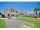 Spacious backyard featuring artificial grass and a horseshoe pit at 412 Orchid Oasis Ave, North Las Vegas, NV 89031