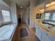 Spacious primary bathroom with soaking tub, dual vanities, and separate shower offers a relaxing retreat at 412 Orchid Oasis Ave, North Las Vegas, NV 89031