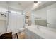 Bathroom featuring a shower with a patterned curtain, vanity, and tile floors at 412 Orchid Oasis Ave, North Las Vegas, NV 89031