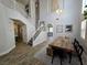 Inviting entryway with staircase, high ceilings, and access to the living and dining areas at 412 Orchid Oasis Ave, North Las Vegas, NV 89031