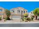 Lovely two-story home with desert landscaping and a two-car garage at 412 Orchid Oasis Ave, North Las Vegas, NV 89031