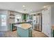 Updated kitchen featuring stainless steel appliances, center island, and wood-look floors at 412 Orchid Oasis Ave, North Las Vegas, NV 89031